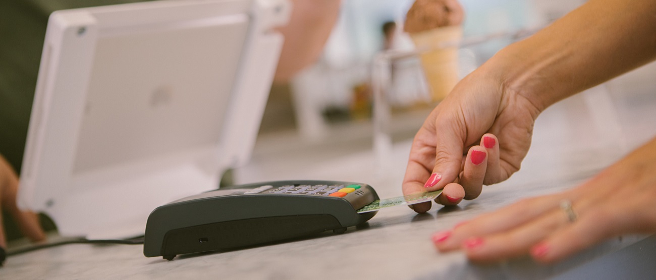 Woman using debit card